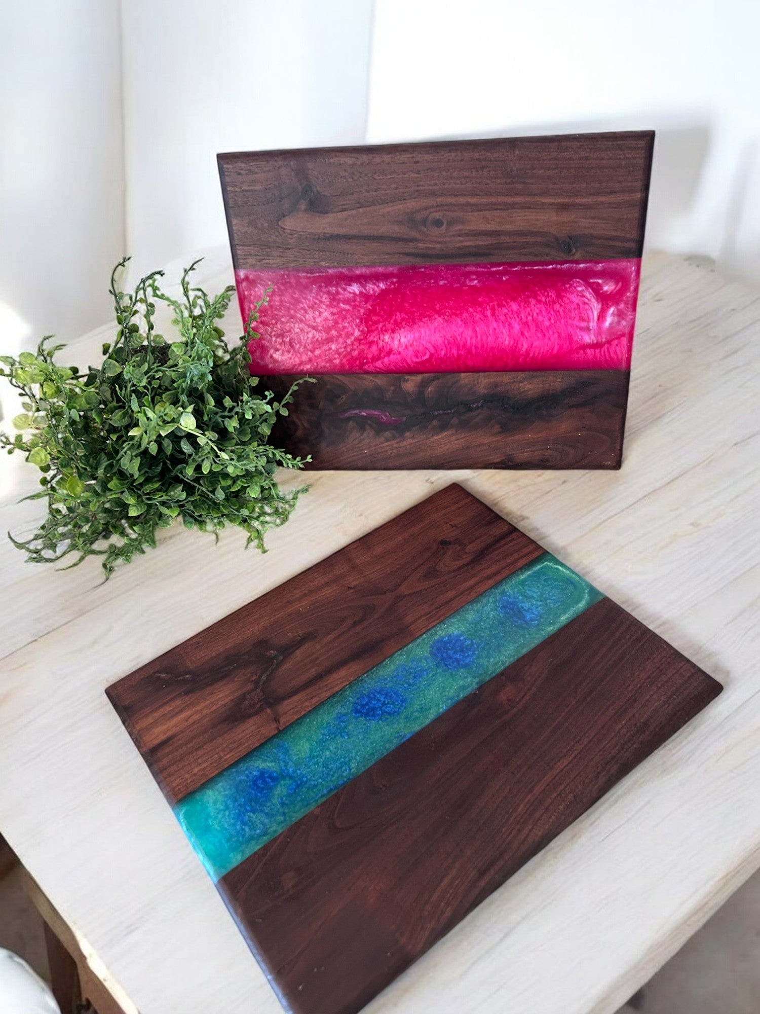 Discover elegance in our Walnut & Pink Epoxy River Board. Handmade with love, each piece is a unique masterpiece. Elevate your dining experience. 